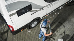 man cleaning a motorhome