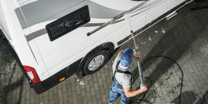 man cleaning a motorhome